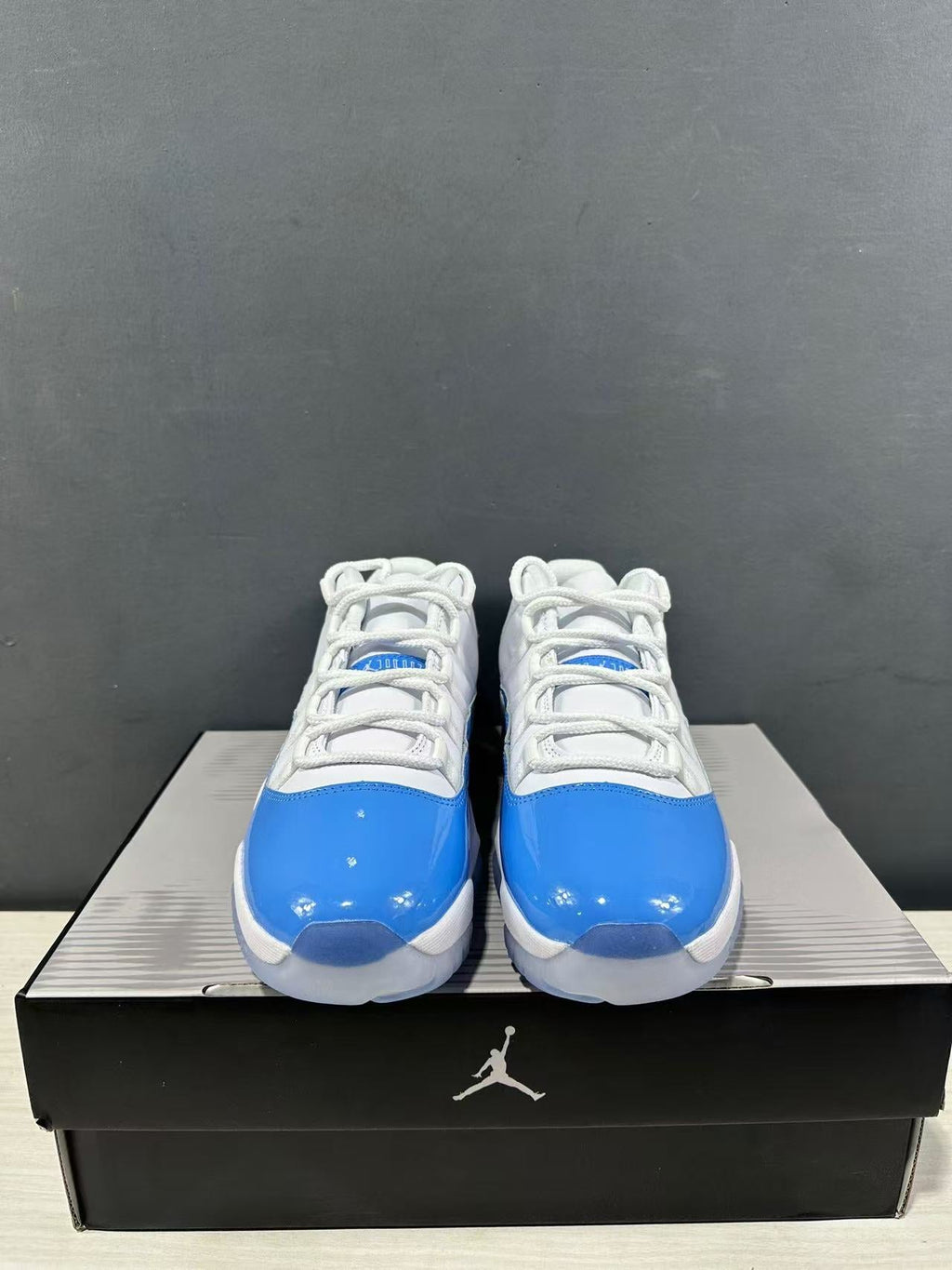 Air Jordan 11 Retro Low UNC Blue Sneakers FV5104-100 - product image from the listing.