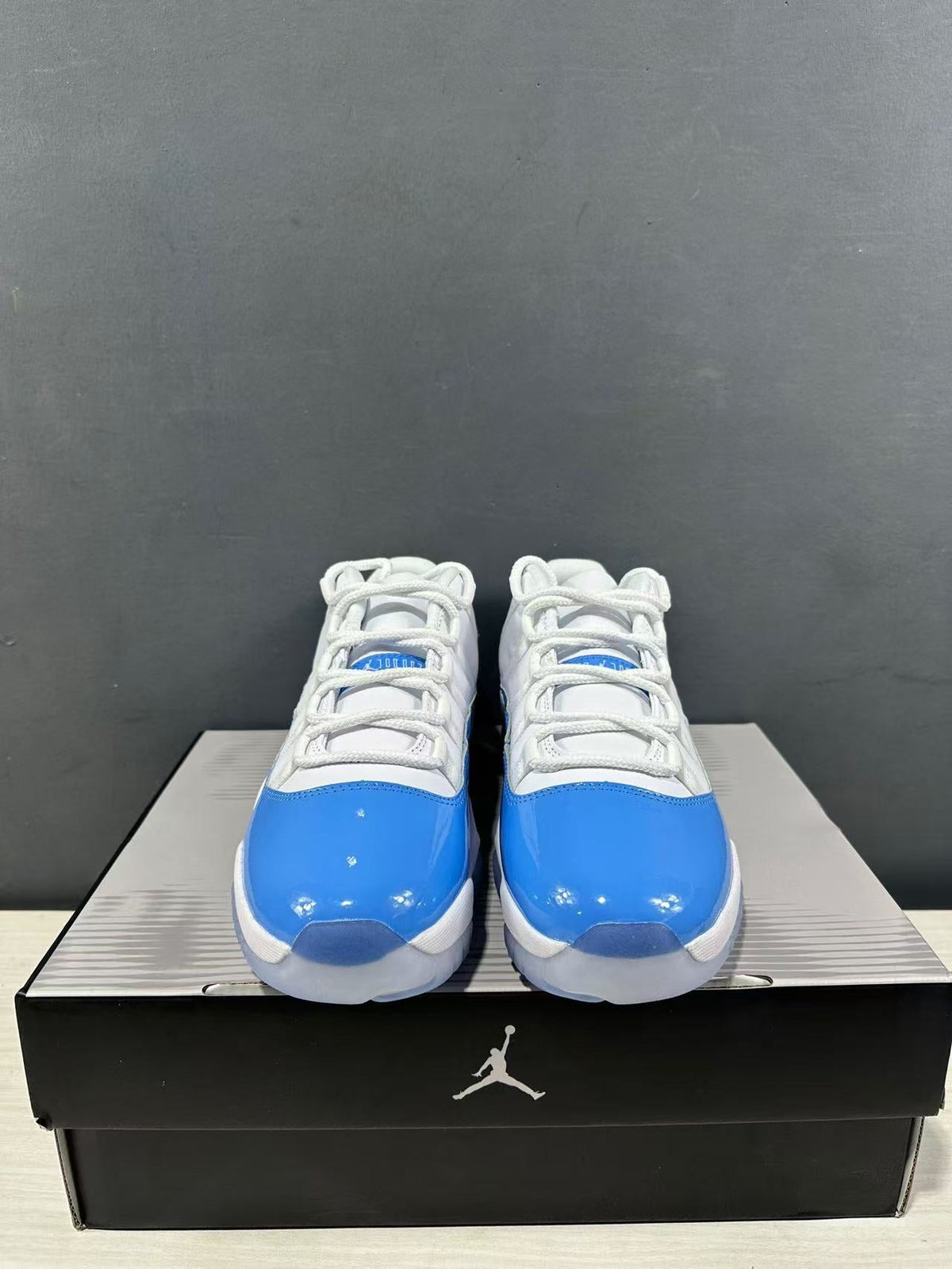 Air Jordan 11 Retro Low UNC Blue Sneakers FV5104-100 - product image from the listing.