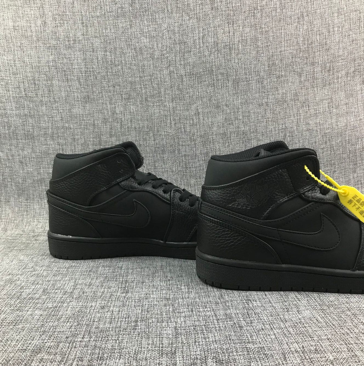 Air Jordan 1 Mid Sneakers, in Black - product image from the listing.