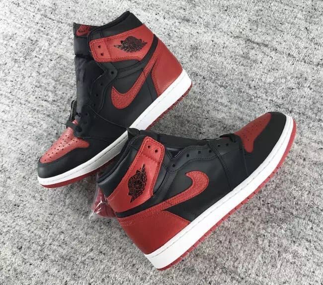 Air Jordan 1 High Sneakers in Black and Red - product image from the listing.