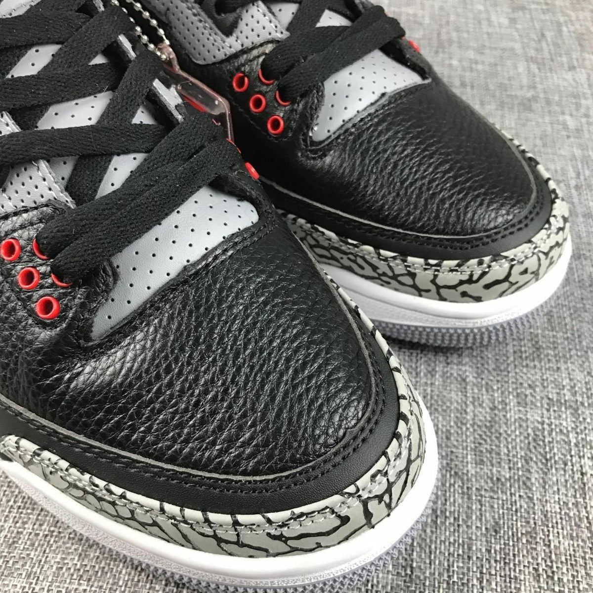 Air Jordan 3 Retro Black Cement Sneakers, in Black and Grey - product image from the listing.