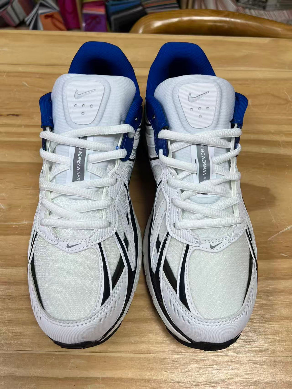 Nike P-6000 Sneakers in White Blue Black IZ4752-100 - product image from the listing.
