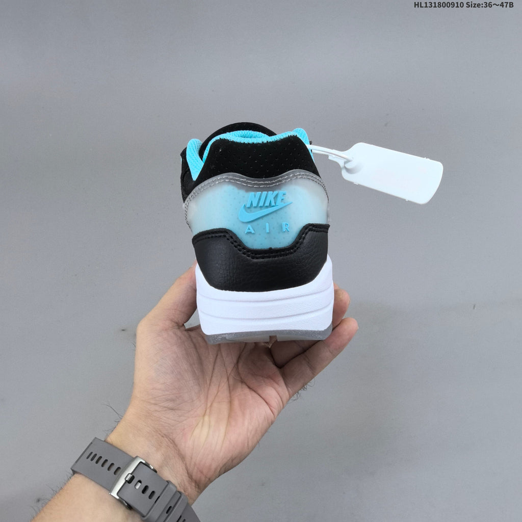 Nike Air Max 1 Sneakers in Black White and Turquoise - product image from the listing.