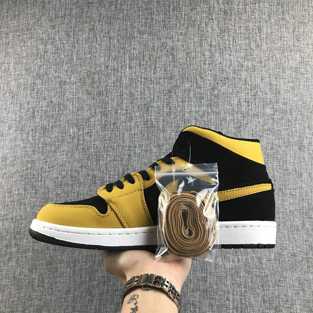 Air Jordan 1 Mid Sneakers in Black and Yellow - product image from the listing.