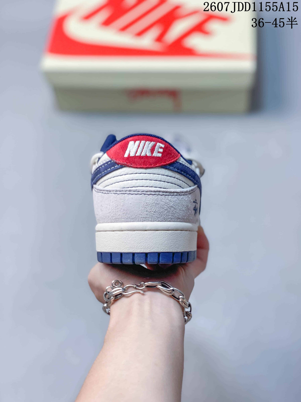 Nike SB Dunk Low Stussy Sneakers in White Grey Navy - product image from the listing.