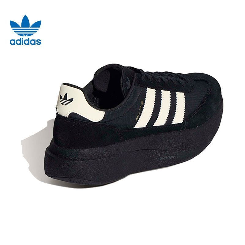 adidas Sneakers in Black and White - product image from the listing.