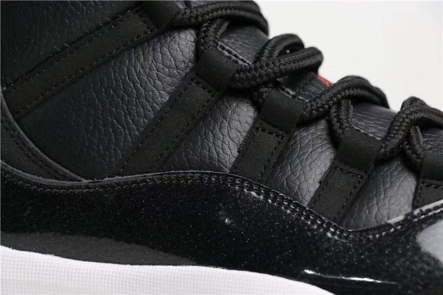 Air Jordan 11 Retro 72-10 High-Top Sneakers in Black and White - product image from the listing.