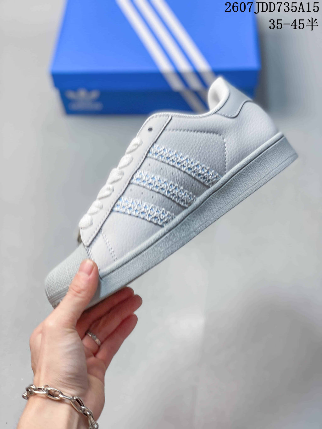 adidas Superstar Sneakers in White Gray Blue 2607JDD735A15 - product image from the listing.