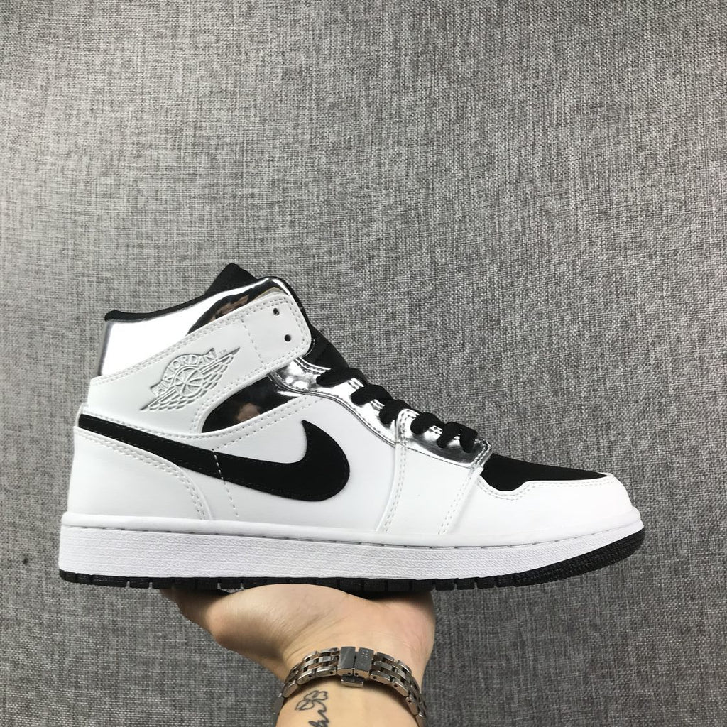 Air Jordan 1 Mid Sneakers in White and Black - product image from the listing.