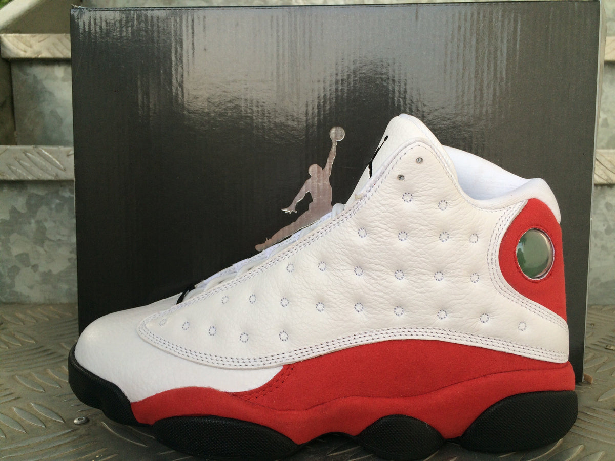 Air Jordan 13 Sneakers in White Red Black - product image from the listing.
