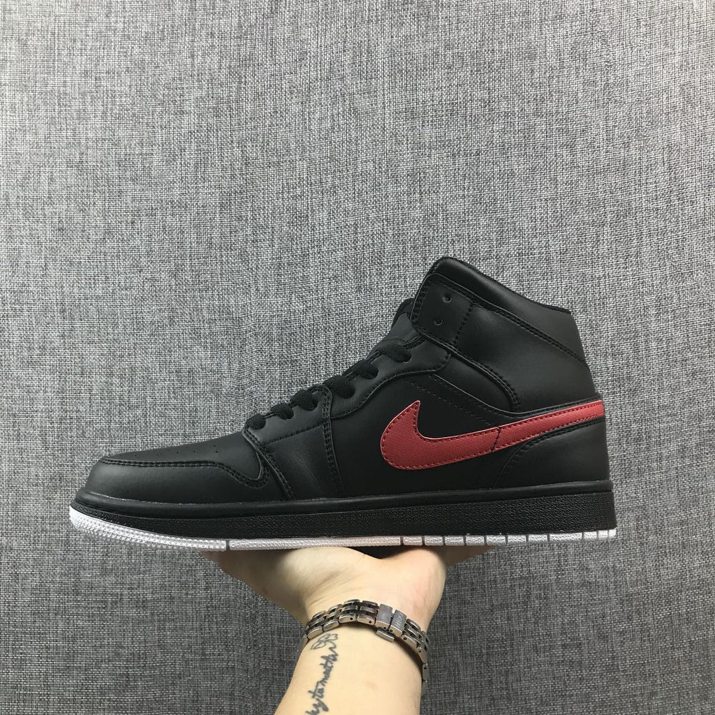 Air Jordan 1 Mid Sneakers in Black and Red 554724-045 - product image from the listing.