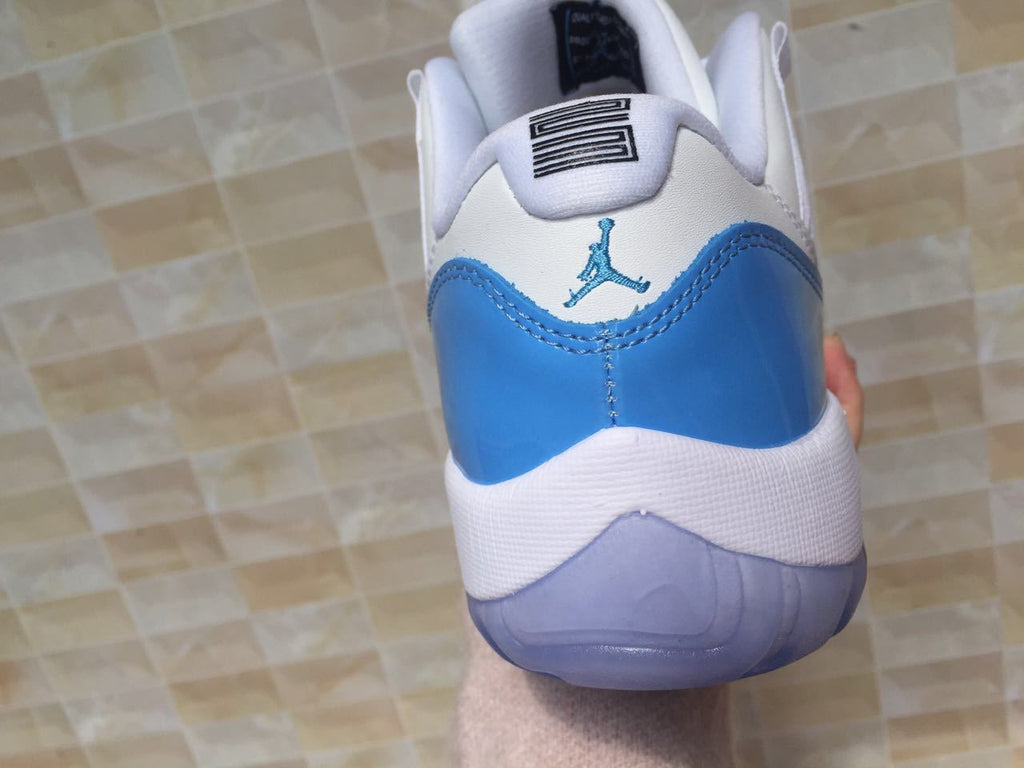 White and University Blue Jordan 11 Low Sneakers - product image from the listing.