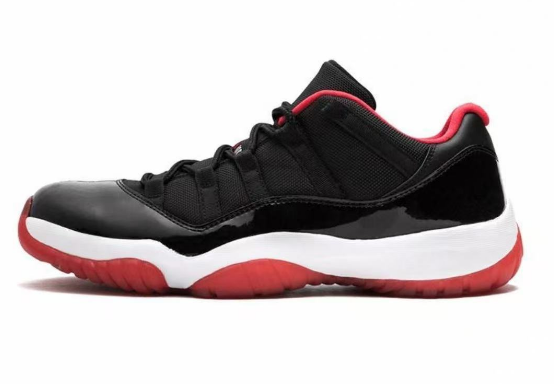 Air Jordan 11 Low Black Red Sneakers 528895-102 - product image from the listing.