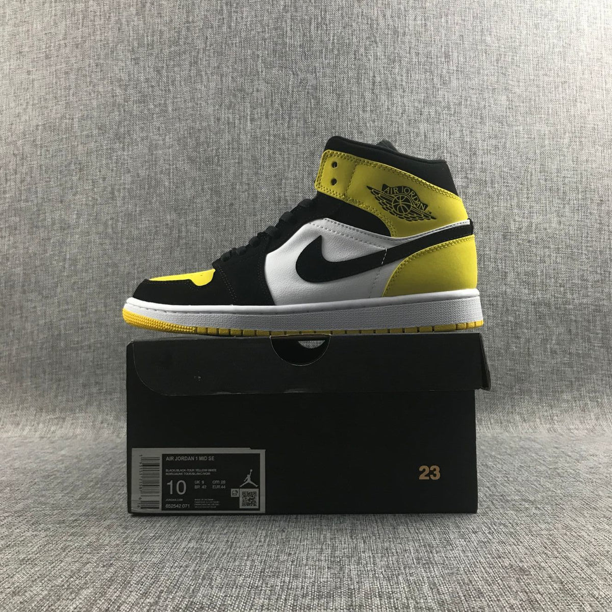 Black Yellow Toe Sneakers - Air Jordan 1 Mid SE 852542-071 - product image from the listing.