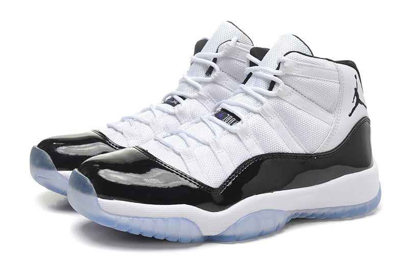 Air Jordan 11 Retro High White and Black Sneakers - product image from the listing.