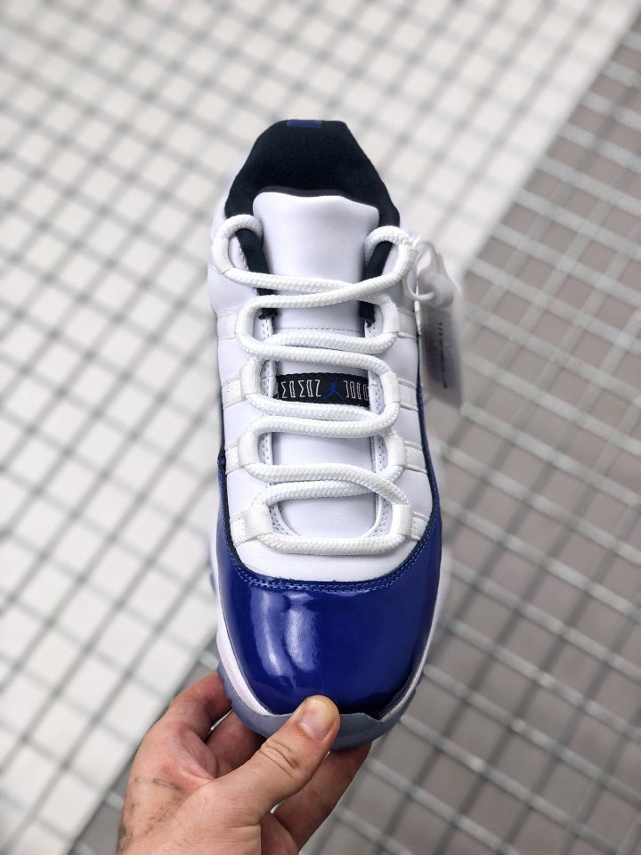 Air Jordan 11 Sneakers in White and Deep Blue BQ3685-001 - product image from the listing.