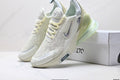 Light Green and White Nike Air Zoom Sneakers - product image from the listing.