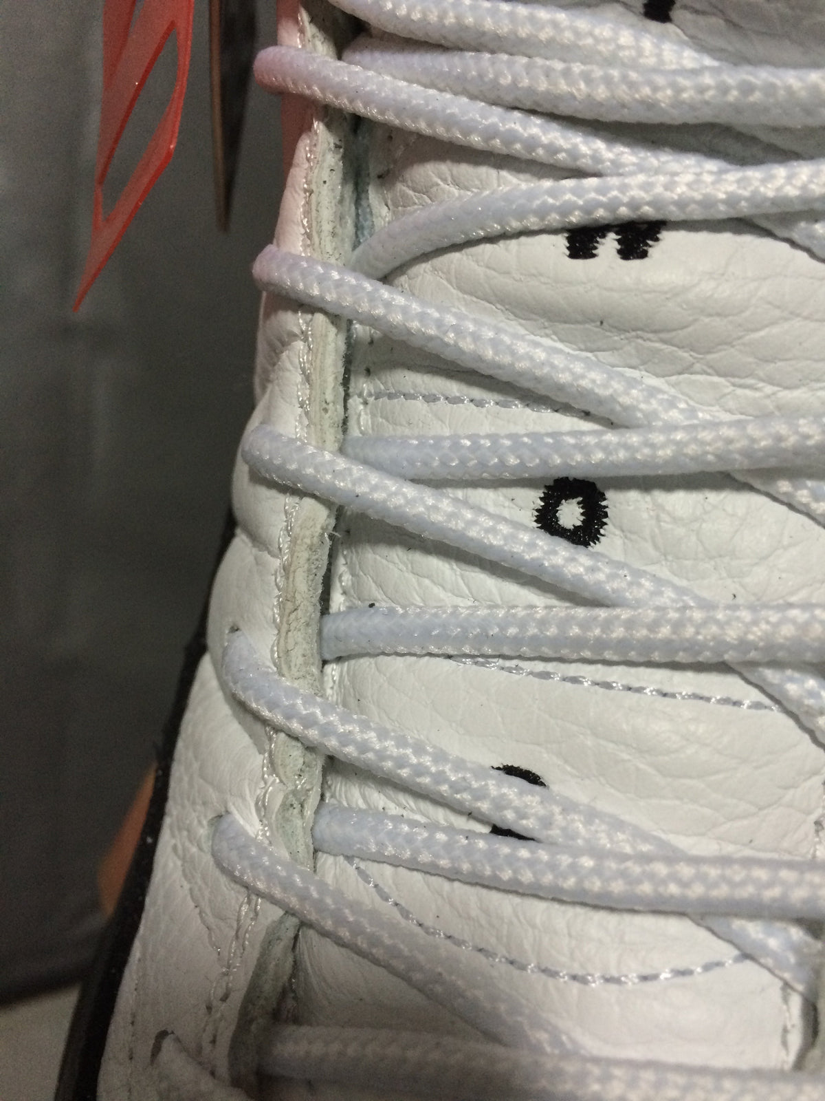 Air Jordan 12 Retro White and Black High-Top Sneakers - product image from the listing.