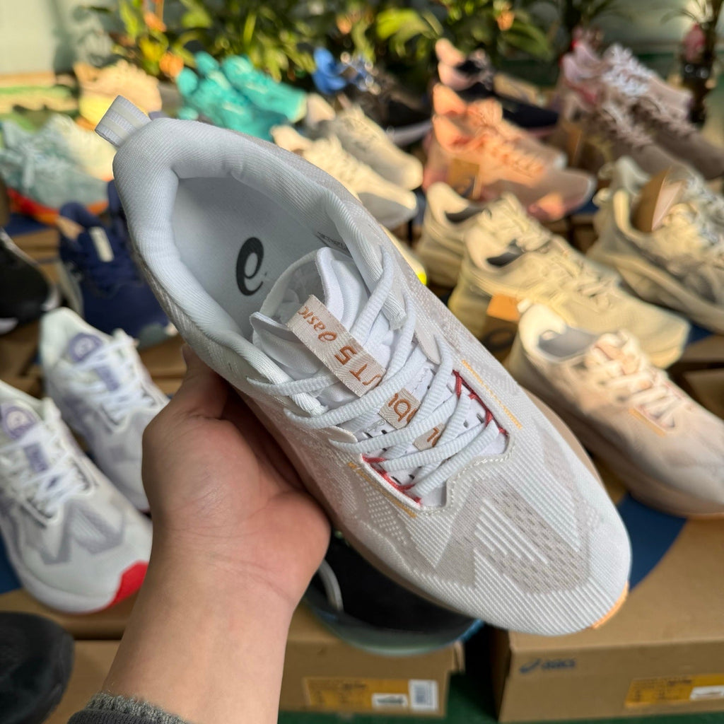 ASICS NOVABLAST 5 LE Running Shoes in White Pink Purple - product image from the listing.