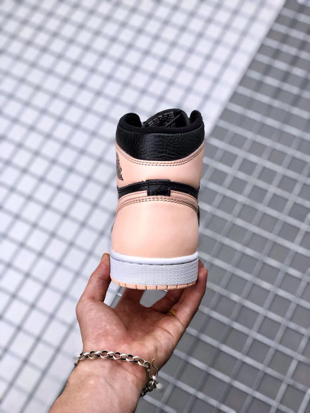 Air Jordan 1 High OG Crimson Tint Sneakers in Black Pink - product image from the listing.