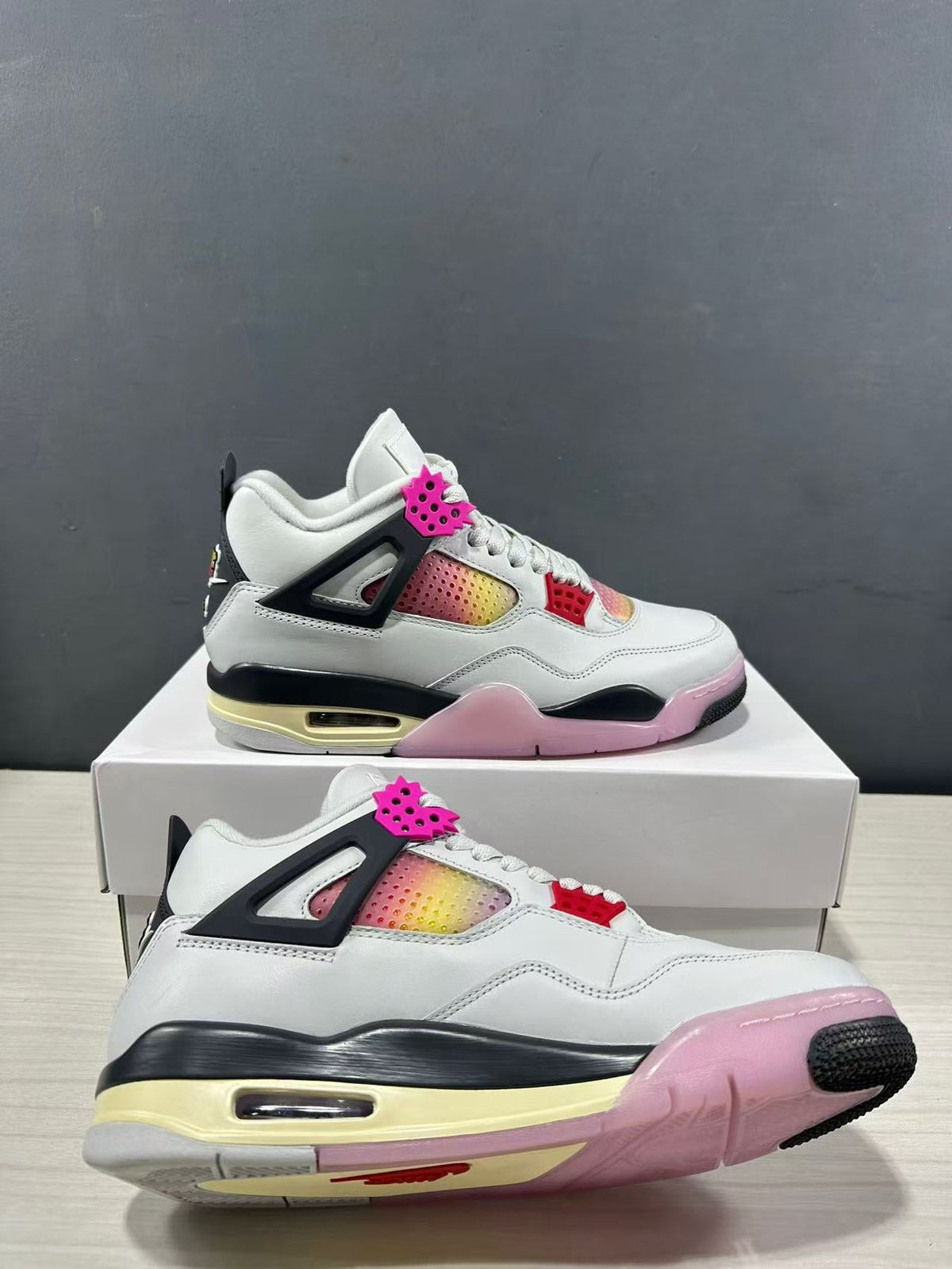 Air Jordan 4 Retro Comic Sneakers White Black Pink JA1135-100 - product image from the listing.