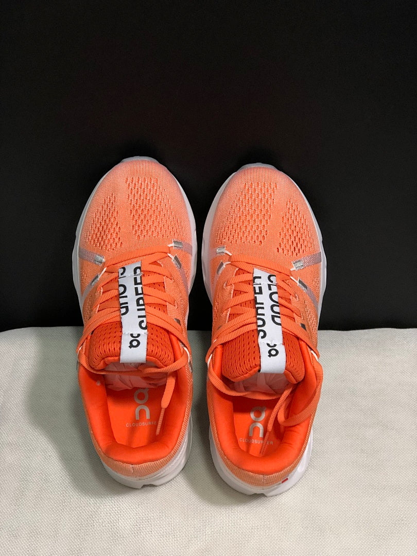 Coral and White On Cloudsurfer Running Shoes - product image from the listing.