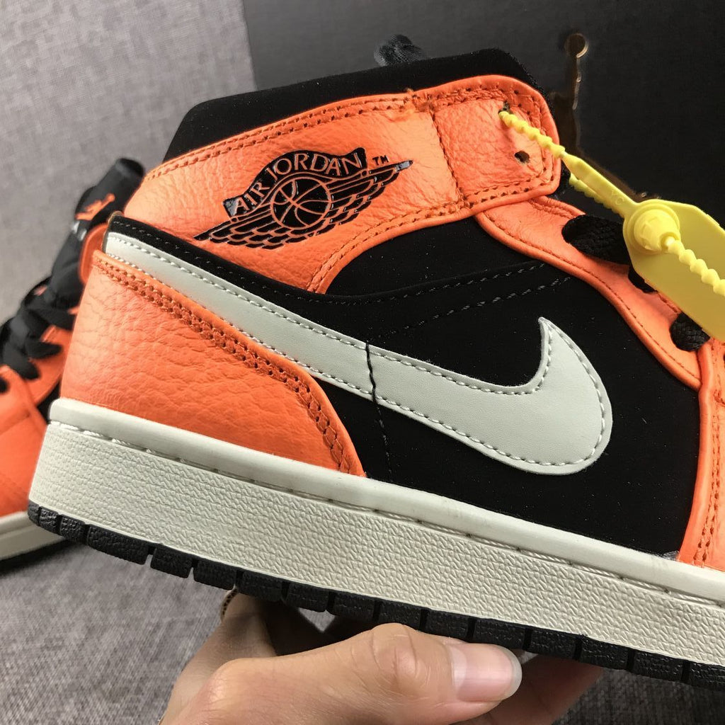 Air Jordan 1 Mid Shattered Backboard Sneakers, in Black and Orange - product image from the listing.