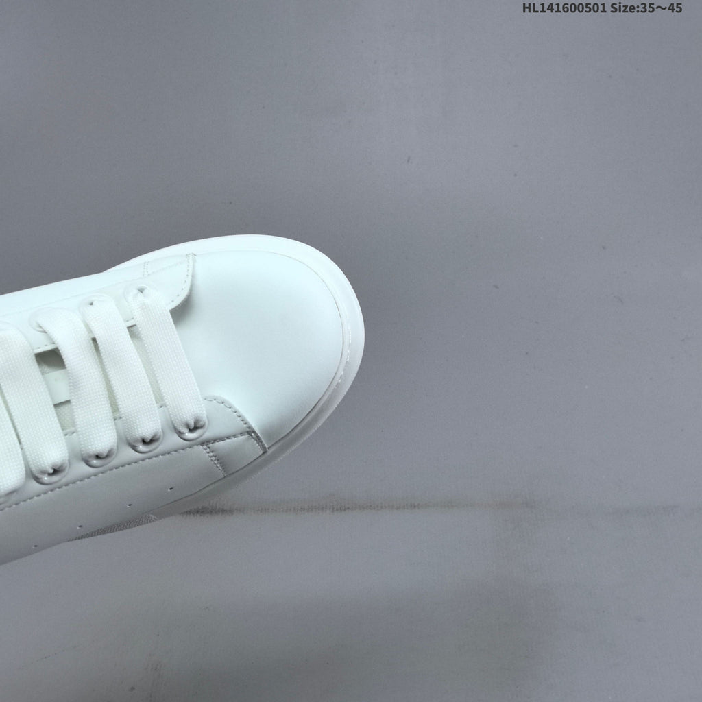 Alexander McQueen Oversized White Low-Cut Sneakers with Black Heel - product image from the listing.