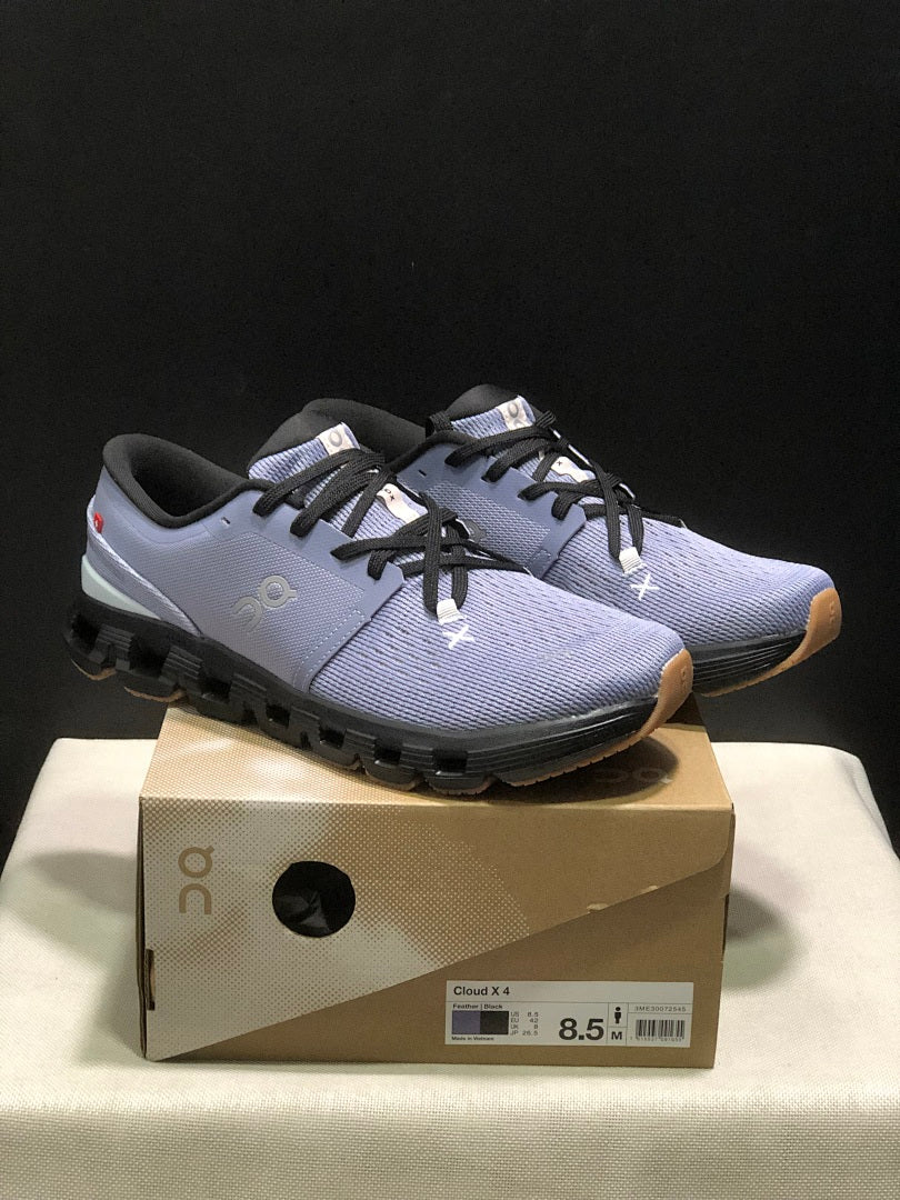 On Cloud X 4 Sneakers in Feather in Black - product image from the listing.