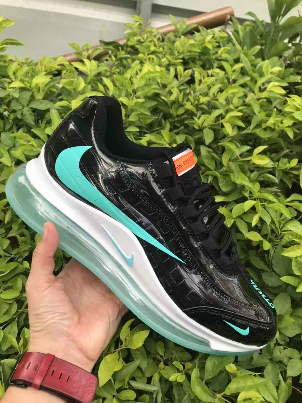 Black and Turquoise Nike Air Max 720 Sneakers - product image from the listing.