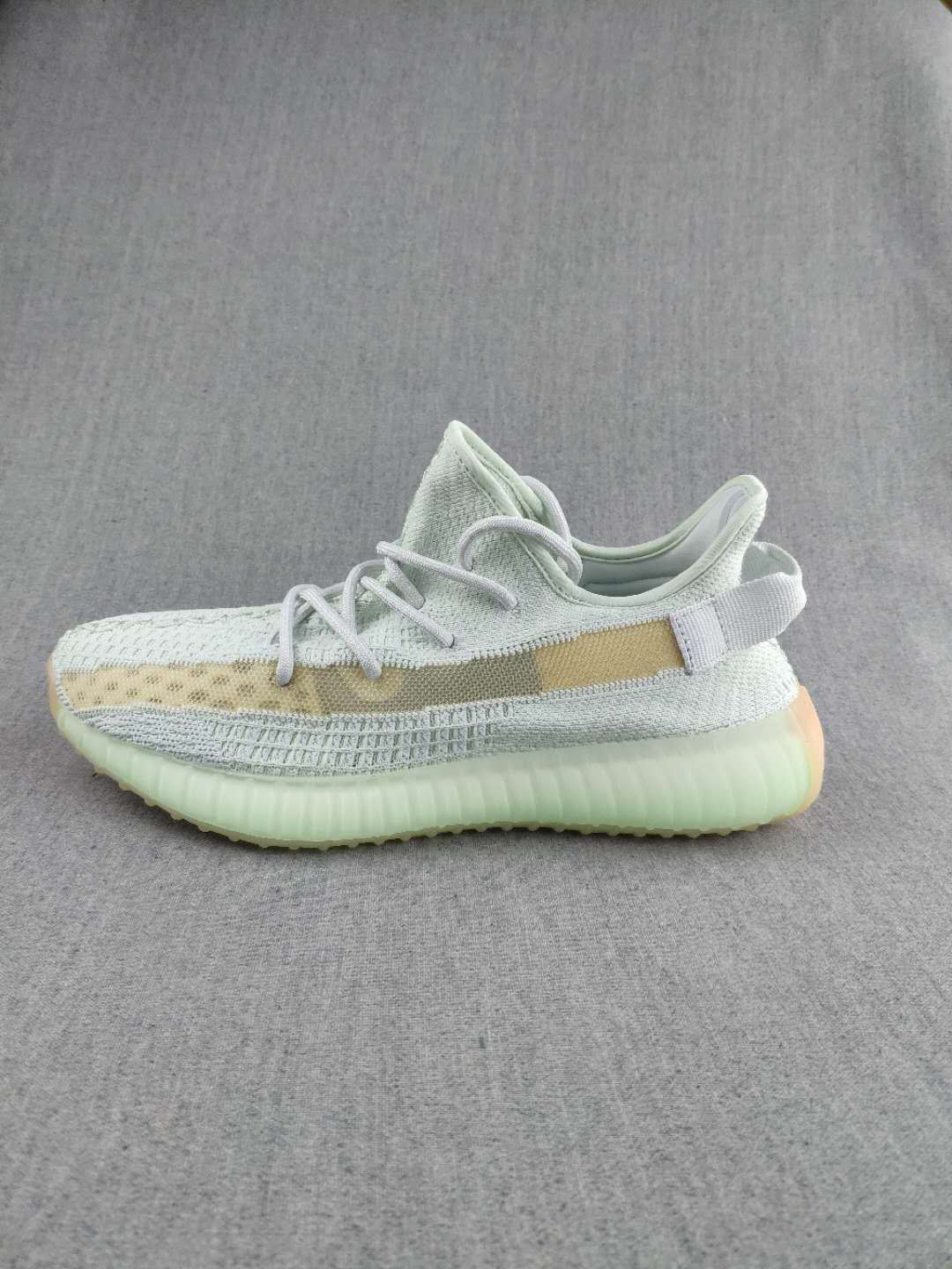White and Tan Yeezy 350 V2 Knit Sneakers - product image from the listing.