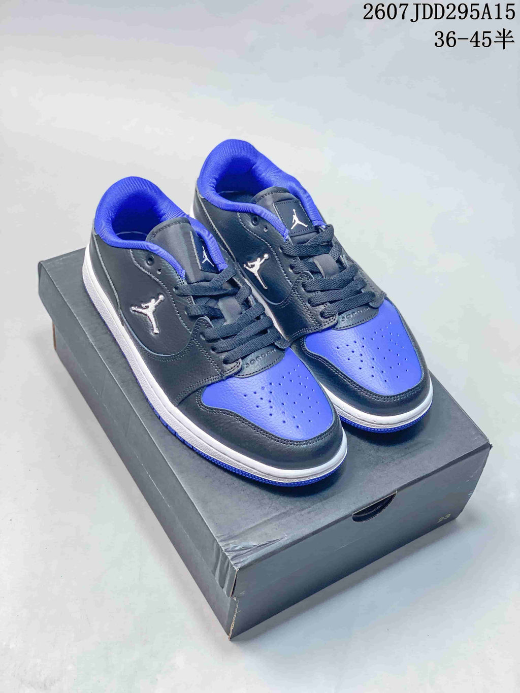Air Jordan 1 Low Black Blue White Sneakers - product image from the listing.