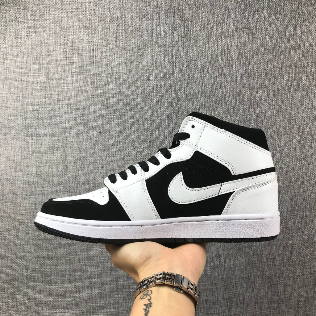 Air Jordan 1 Mid Black White Sneakers 554724-113 - product image from the listing.