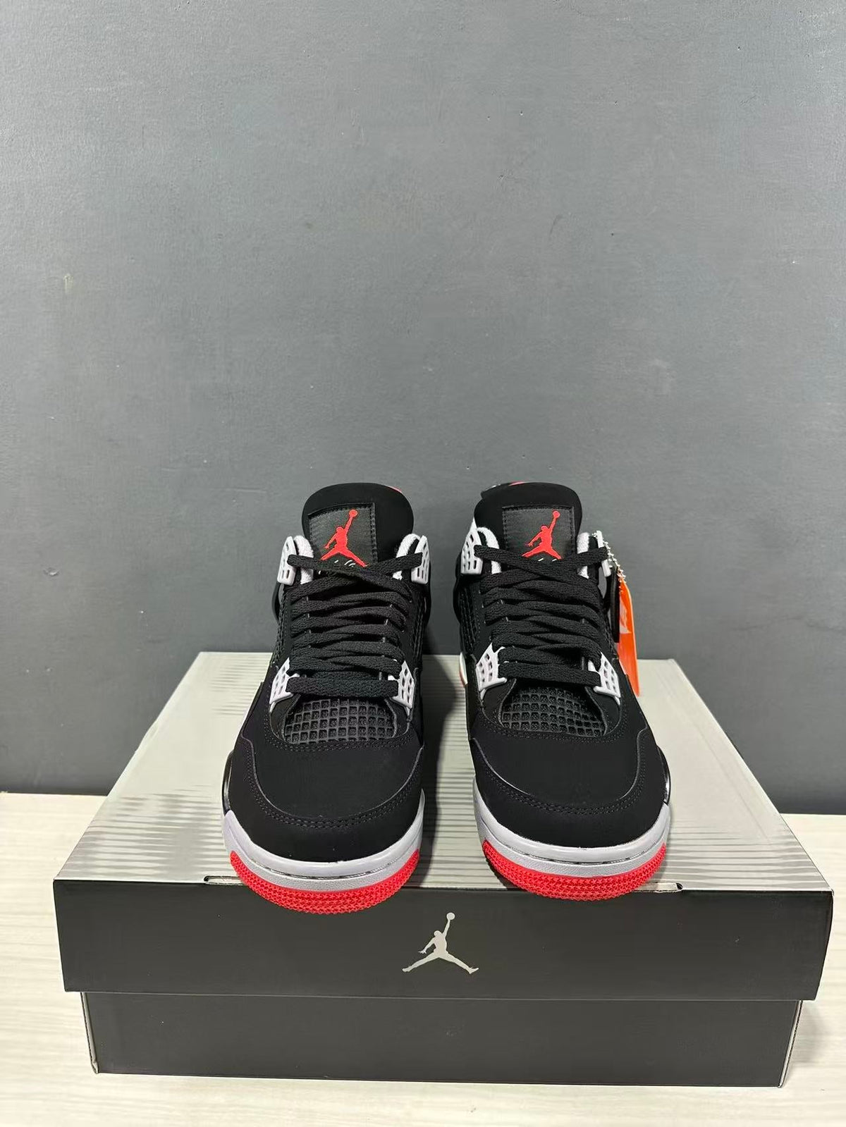 Air Jordan 4 Retro Bred Black Red Sneakers IX8180-001 - product image from the listing.