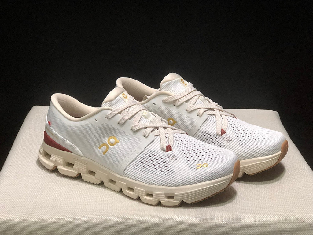 On Cloud X 4 Year of the Snake Sneakers in Ivory Cream - product image from the listing.