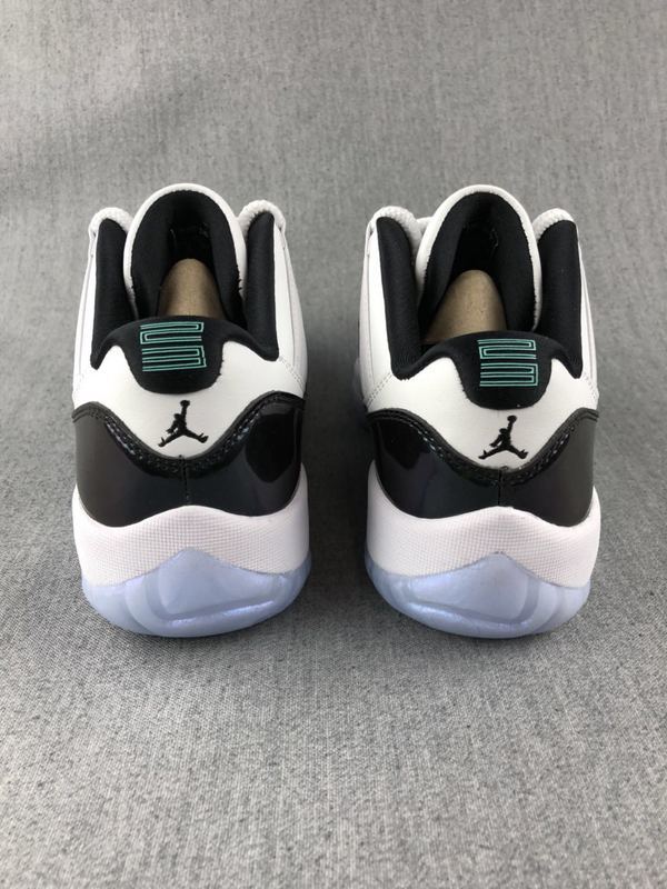 White and Black Jordan 11 Low Sneakers - product image from the listing.