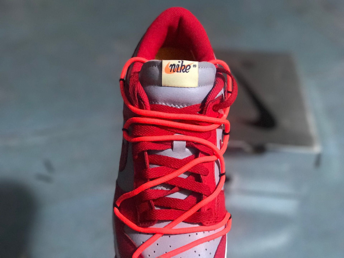 Nike Dunk Low LTHR / OW Sneakers in Red Gray CT0856-600 - product image from the listing.