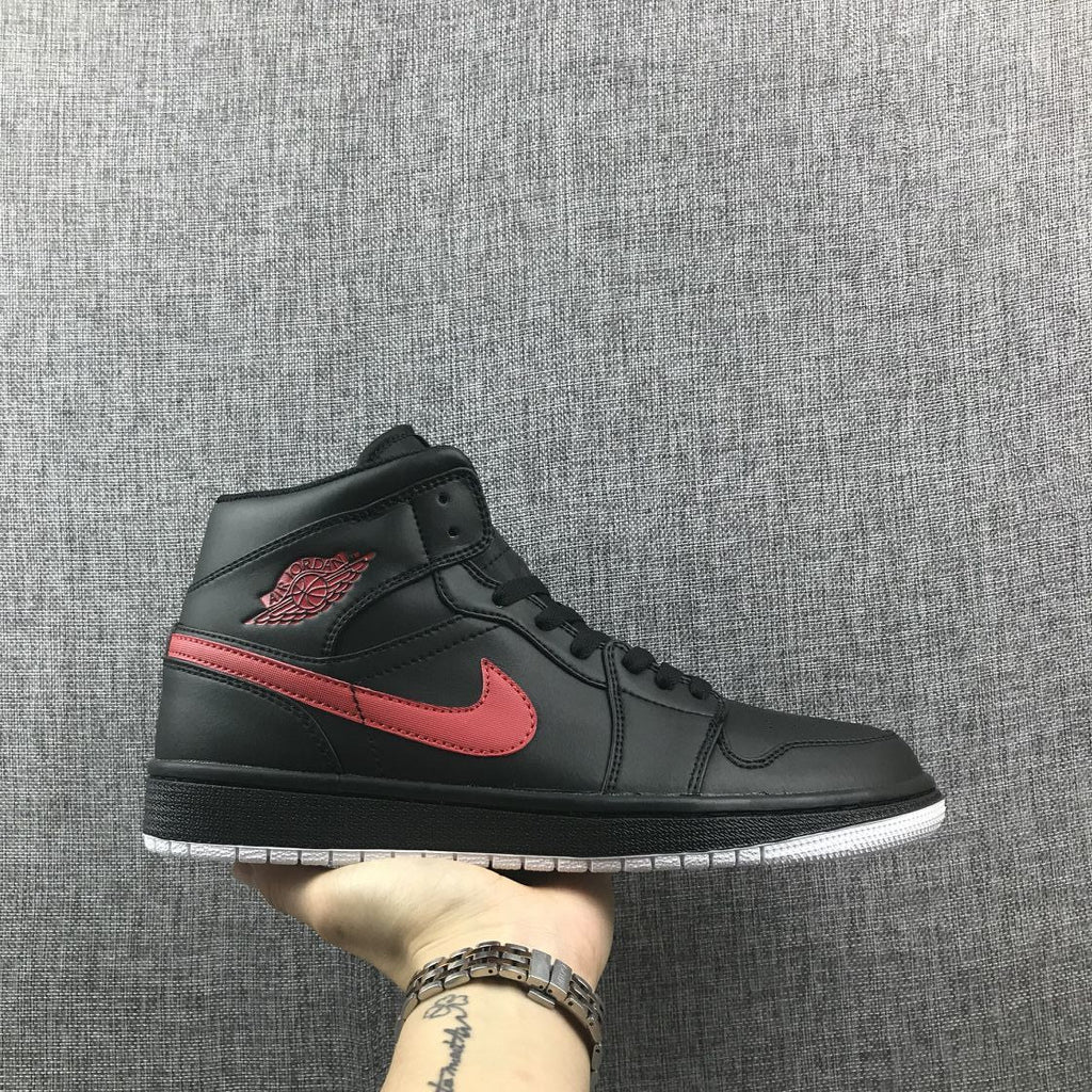 Air Jordan 1 Mid Sneakers in Black and Red 554724-045 - product image from the listing.
