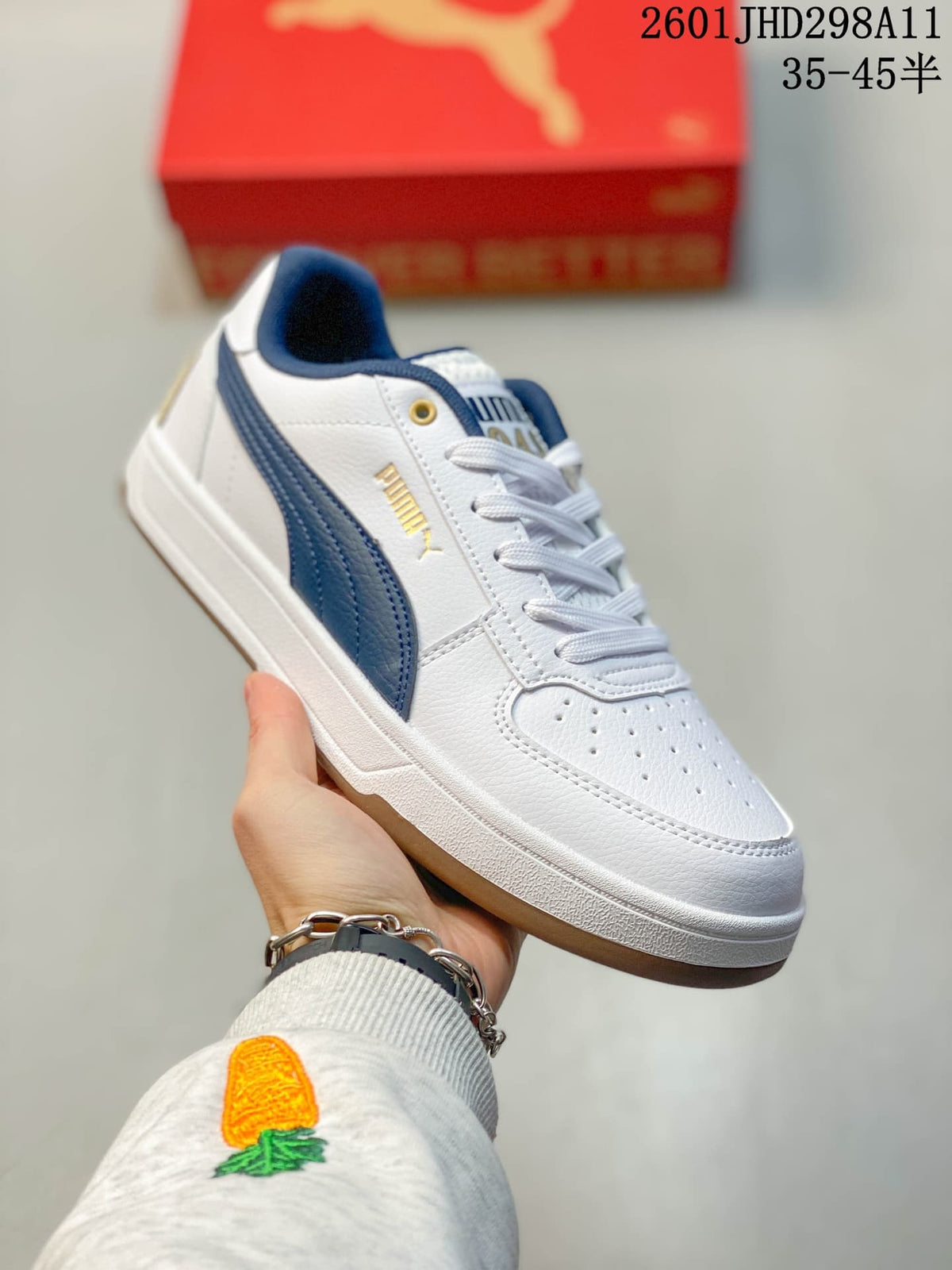 Puma Caven 2.0 Low-Top Sneakers in Red and White/Navy - product image from the listing.