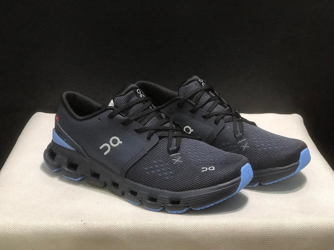 On Cloud X 4 Running Sneakers in Navy - product image from the listing.