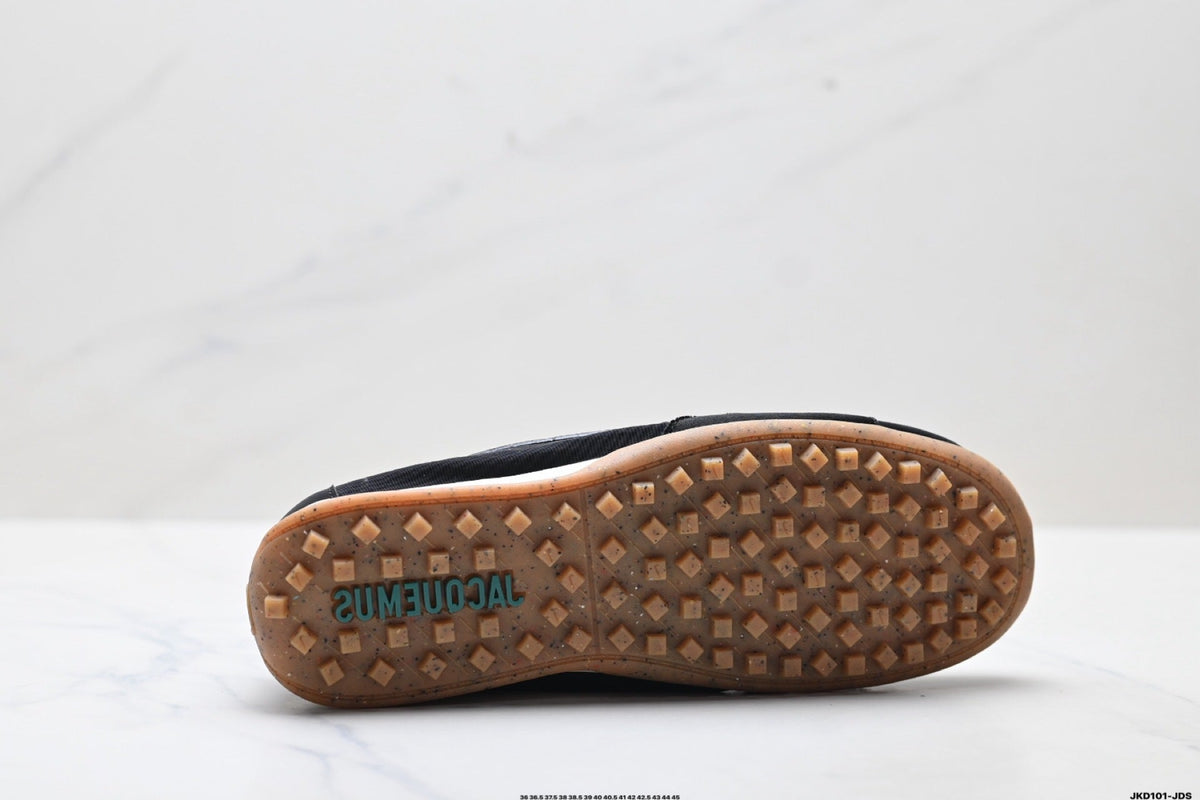 Jacquemus x Nike Jacumoon Sneakers in Black and White - product image from the listing.