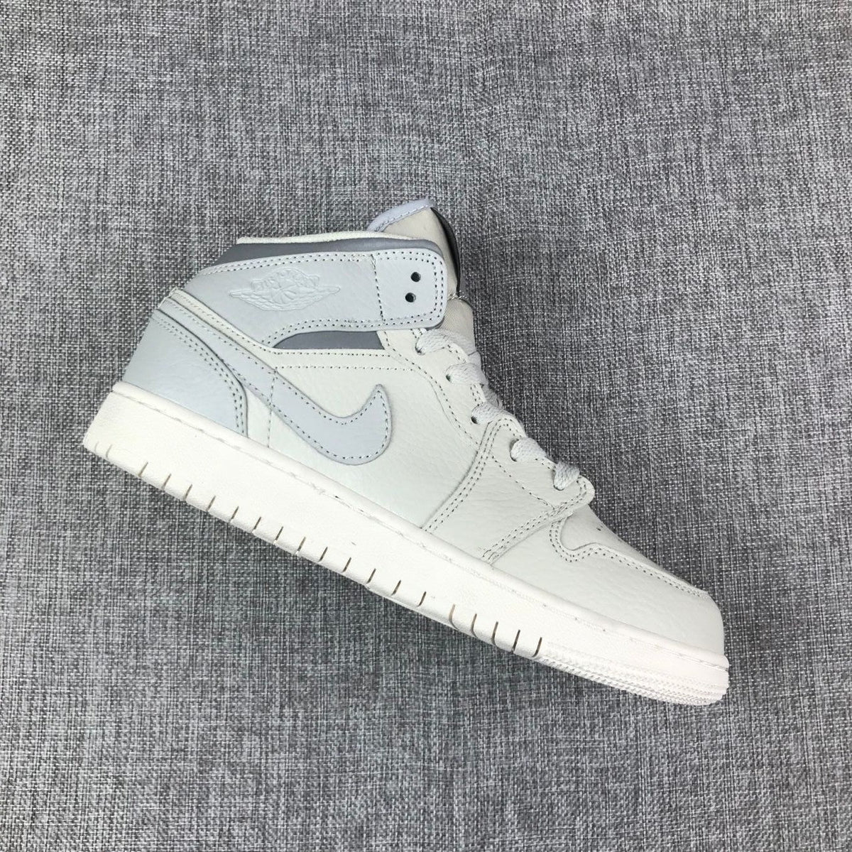 White and Grey Air Jordan 1 Mid Sneakers - product image from the listing.