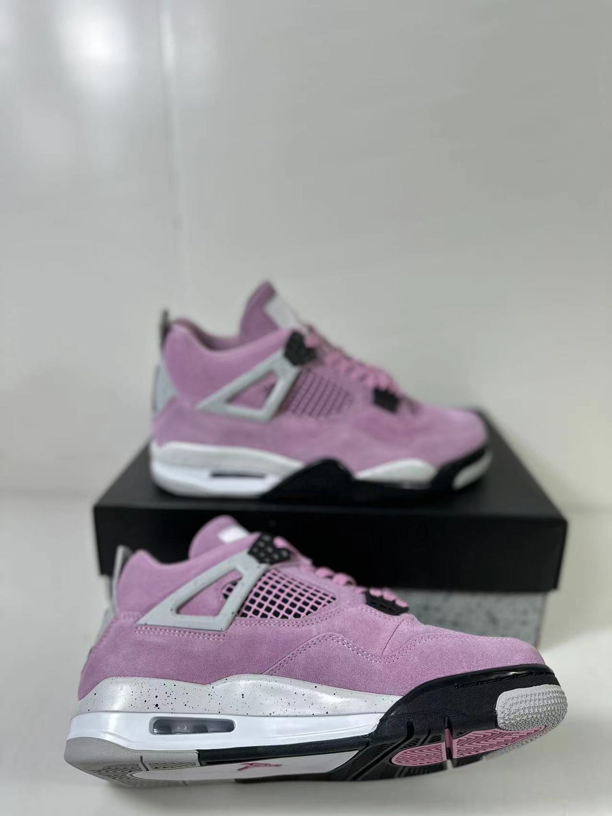 Air Jordan 4 Retro Orchid Pink Sneakers AQ9129-501 - product image from the listing.