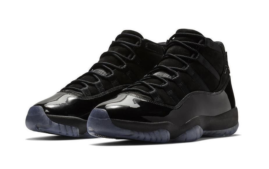 Air Jordan 11 Cap and Gown High-Top Sneakers in Black - product image from the listing.