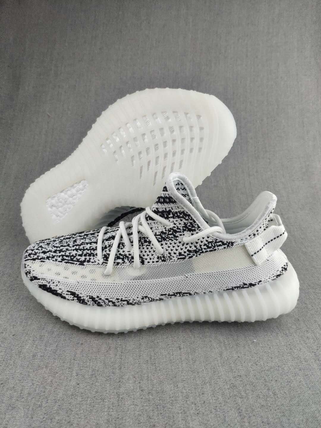 Black and White Yeezy 350 V2 Knit Sneakers - product image from the listing.