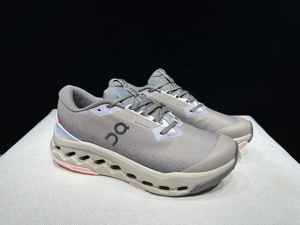 On Cloudsurfer Trail 2 Waterproof Trail Shoes Pink/Brown in Grey - product image from the listing.