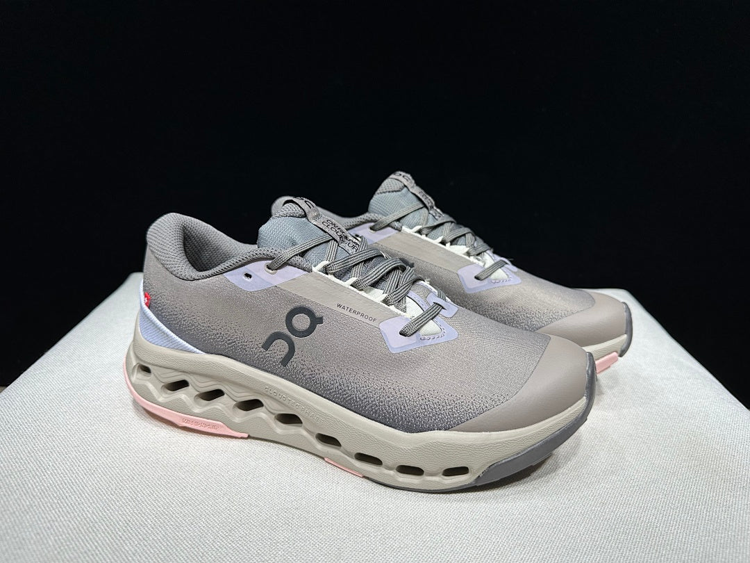 On Cloudsurfer Trail 2 Waterproof Trail Shoes Pink/Brown in Grey - product image from the listing.