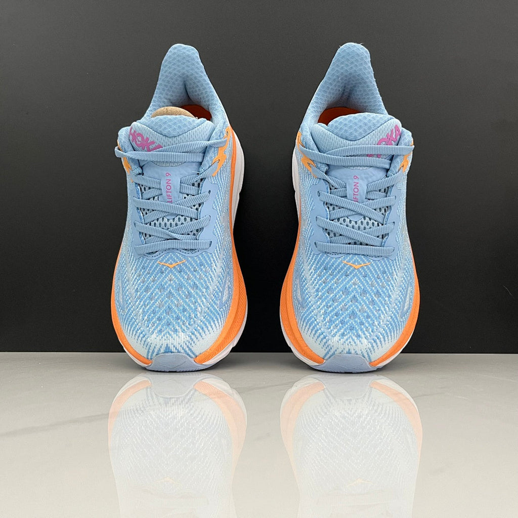 HOKA Clifton 9 Running Shoes in Blue and Orange - product image from the listing.