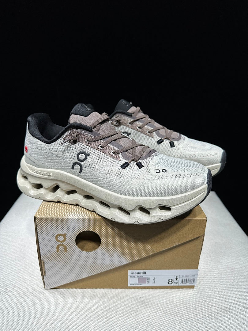 On Cloudtilt Sneakers, in Light Gray and Black - product image from the listing.