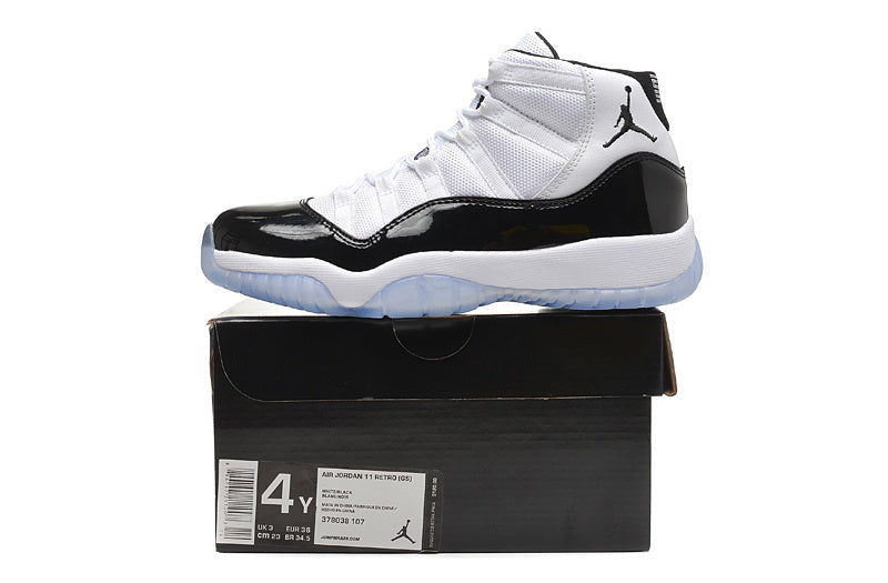 Air Jordan 11 Retro High White and Black Sneakers - product image from the listing.